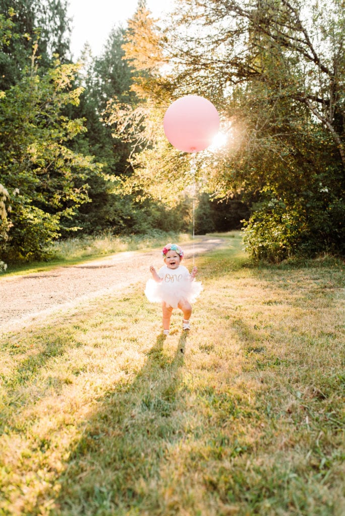 First birthday family photoshoot at an Oregon park at sunset.  Tutus, flower crowns and a giant pink balloon! 