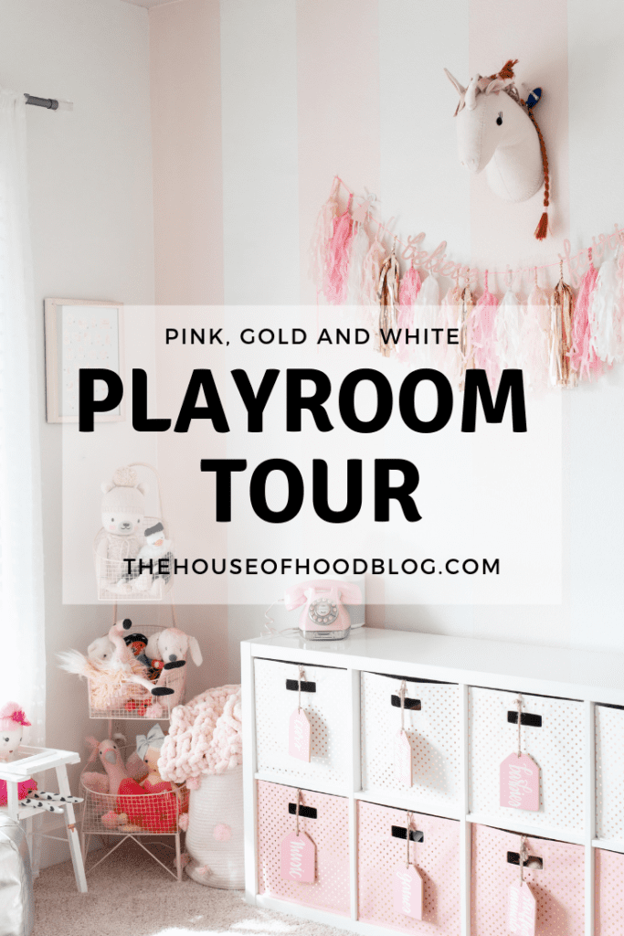 pink and white striped girls playroom with gold accents 
