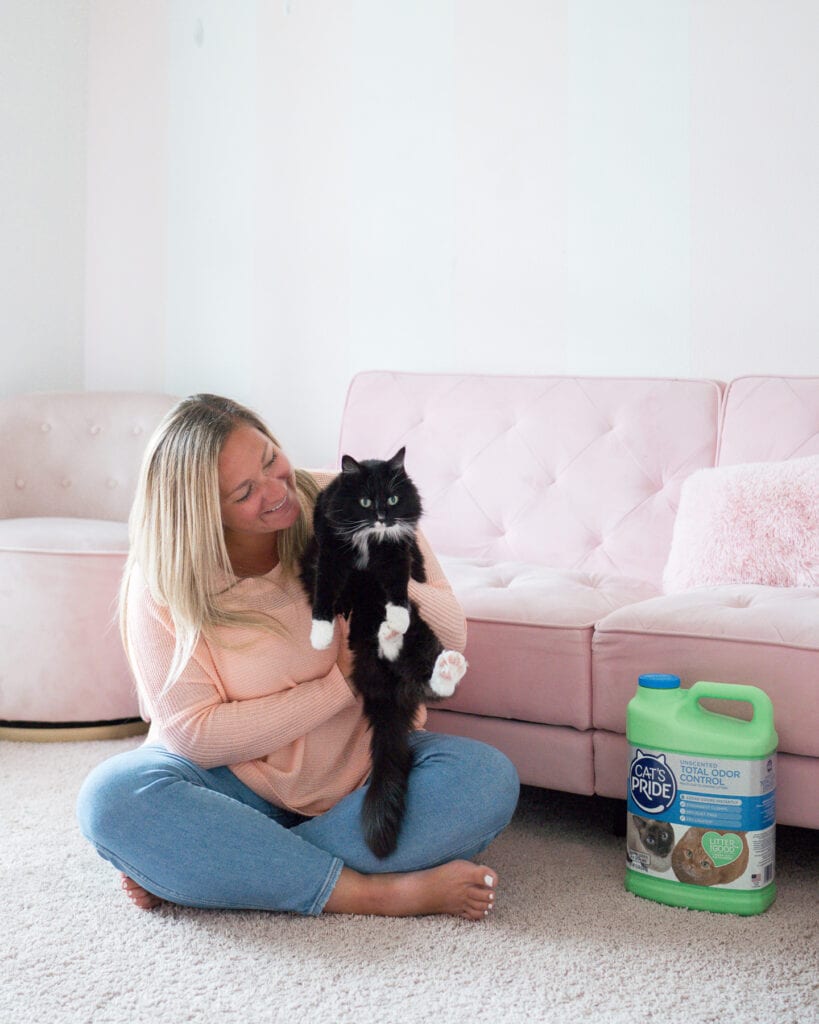 woman with cat in arms 
