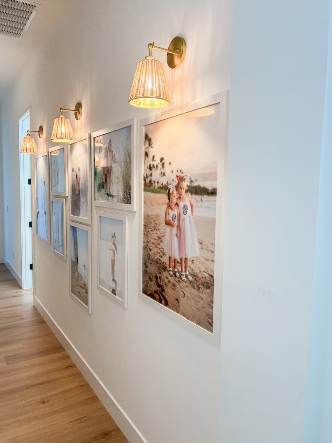 Rattan light sconces with a coastal photo wall